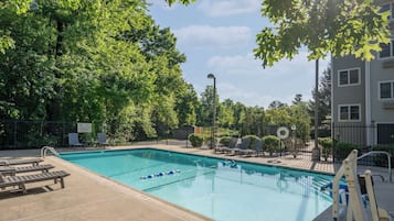 Seasonal outdoor pool, open 8:00 AM to 9 PM, pool umbrellas