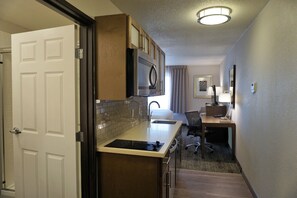 Studio Suite, 1 King Bed, Kitchen | Private kitchen | Fridge, microwave, coffee/tea maker, cookware/dishes/utensils