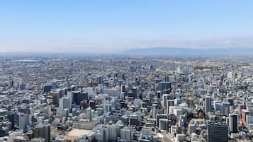 A densely packed urban cityscape with numerous high-rise buildings and a clear sky.