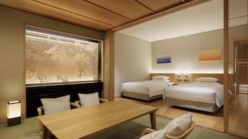 A hotel room with a wooden ceiling, a dining table, two beds, and a window with a decorative screen.