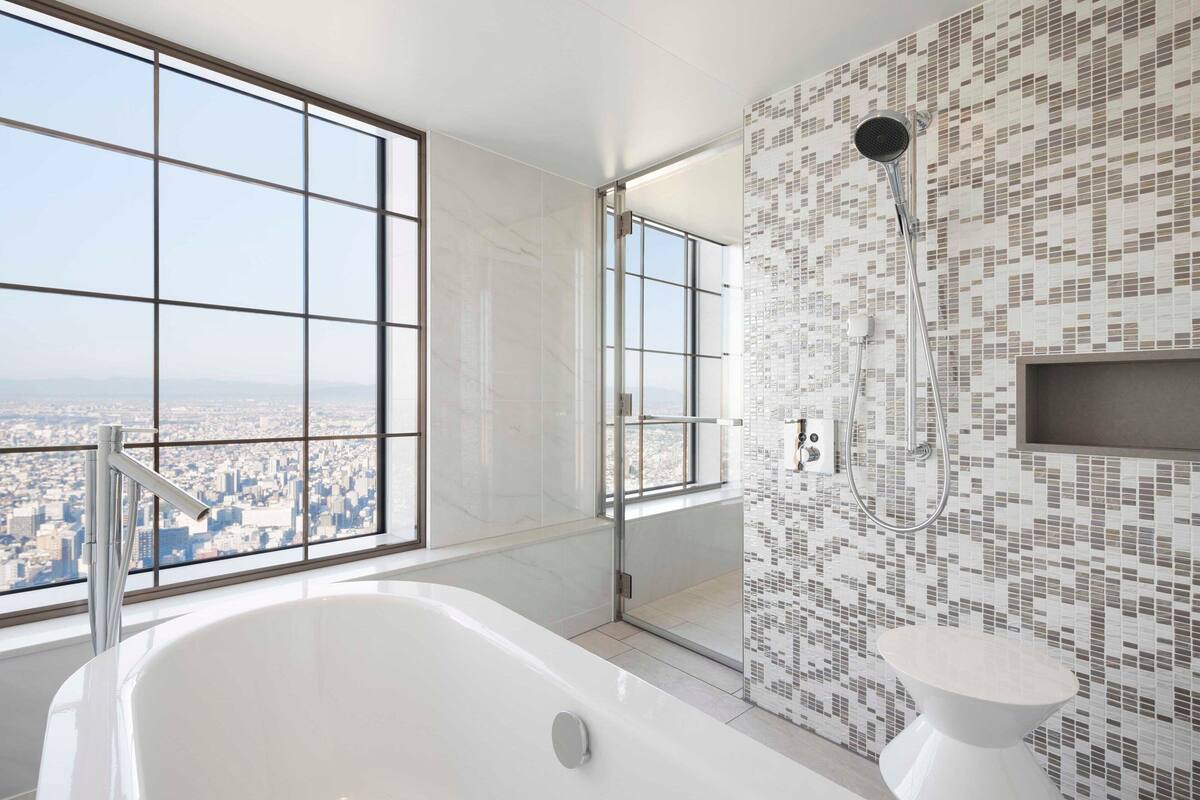 signature suite, 1 king bed, non smoking | bathroom | combined shower/bathtub, free toiletries, hair dryer, bathrobes