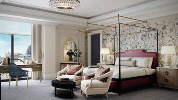 A spacious bedroom with a four-poster bed, a desk with a chair, and a view of the city.