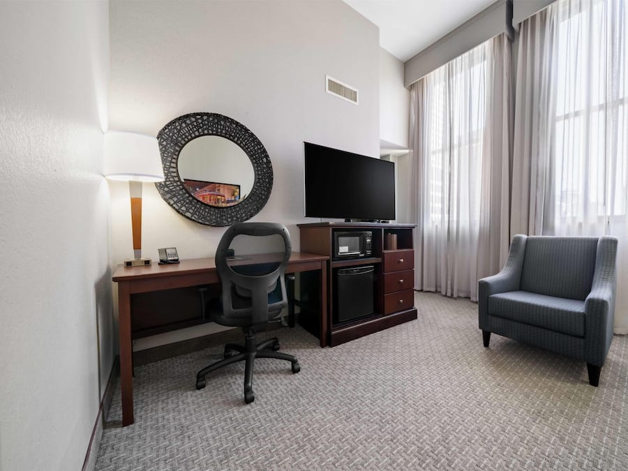 Desk, laptop workspace, blackout drapes, iron/ironing board