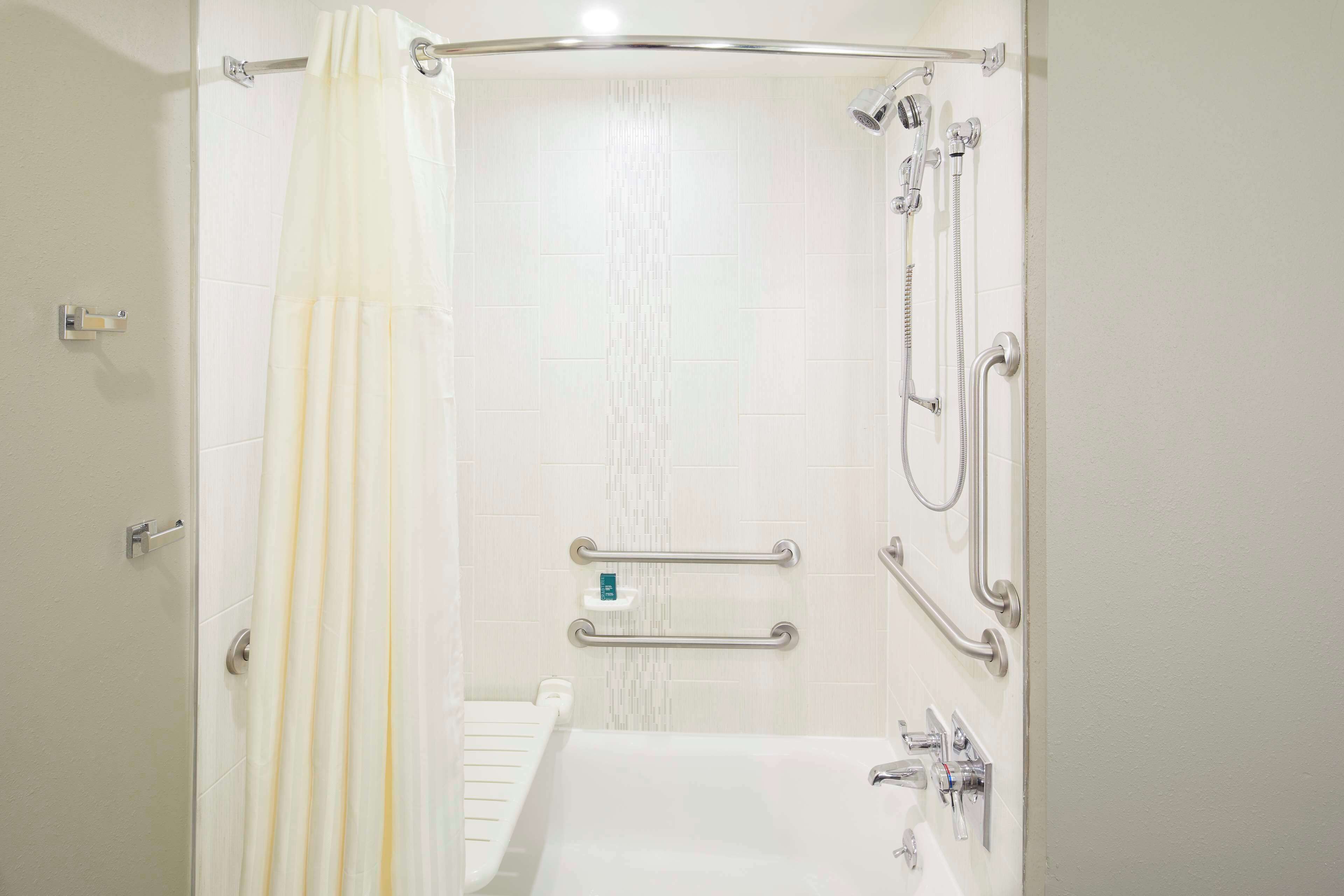 shower, designer toiletries, hair dryer, towels