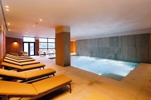 Indoor pool, seasonal outdoor pool, open 8 AM to 9 PM, sun loungers