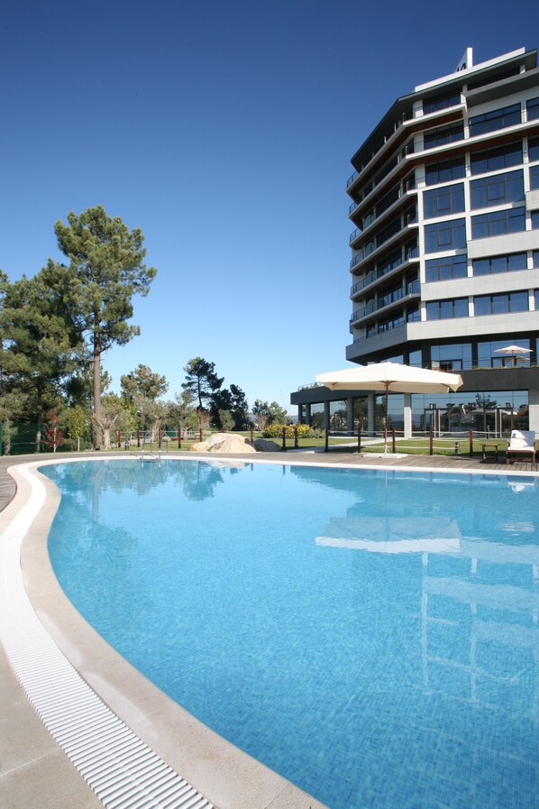 Indoor pool, seasonal outdoor pool, open 8 AM to 9 PM, pool loungers