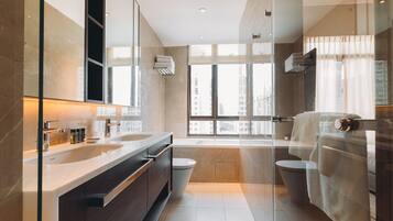 Combined shower/bathtub, deep-soaking bathtub, designer toiletries