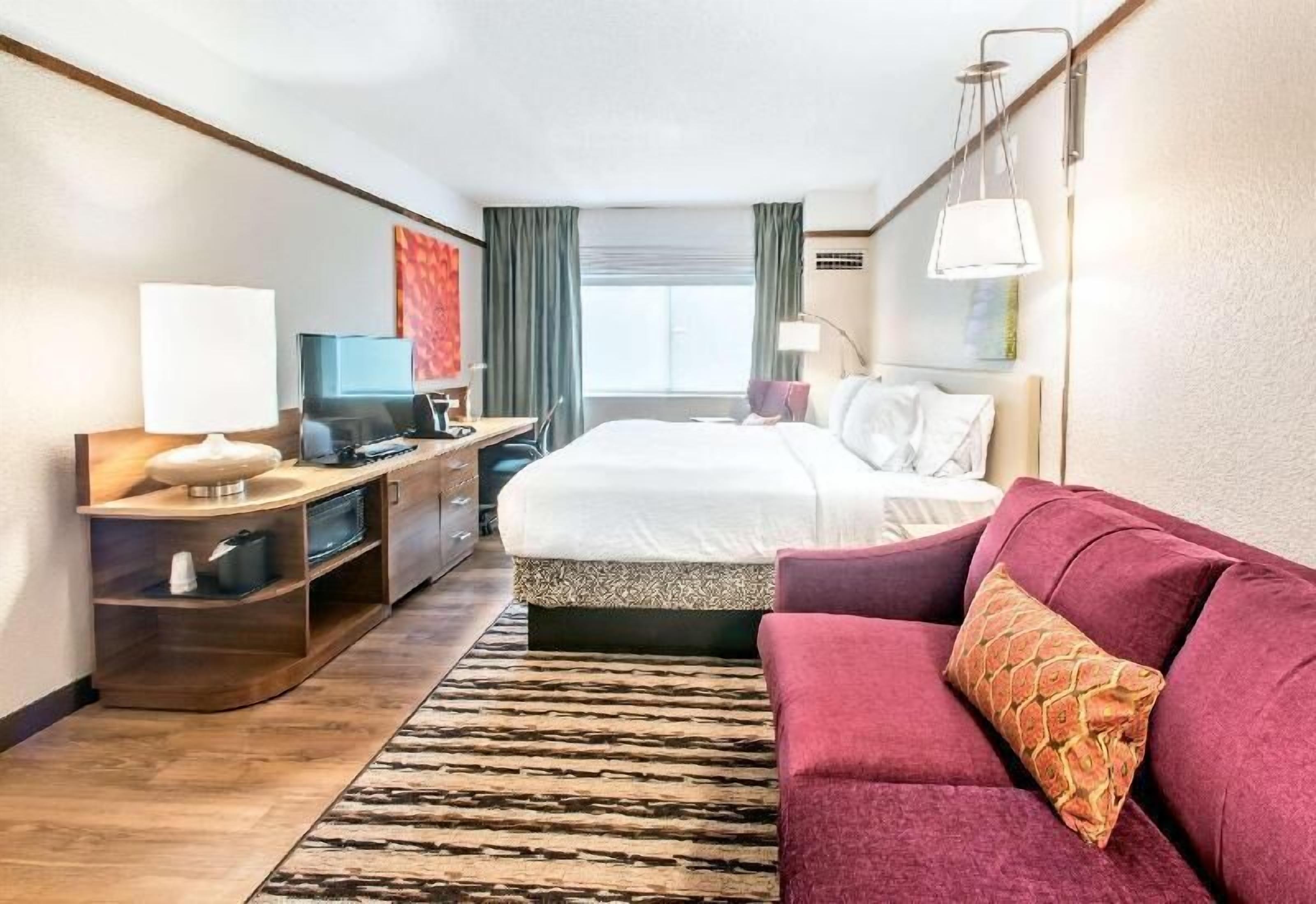 Desk, laptop workspace, blackout drapes, free cribs/infant beds