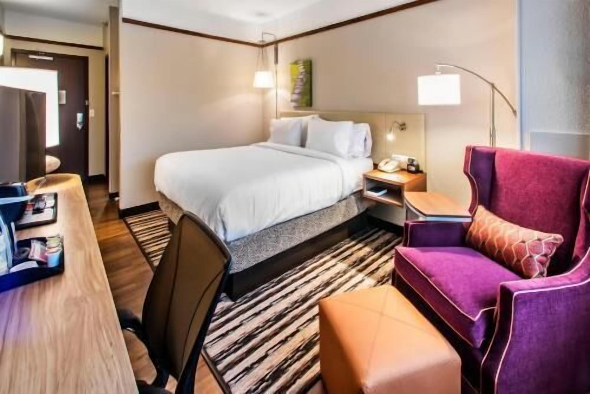 Desk, laptop workspace, blackout drapes, free cribs/infant beds