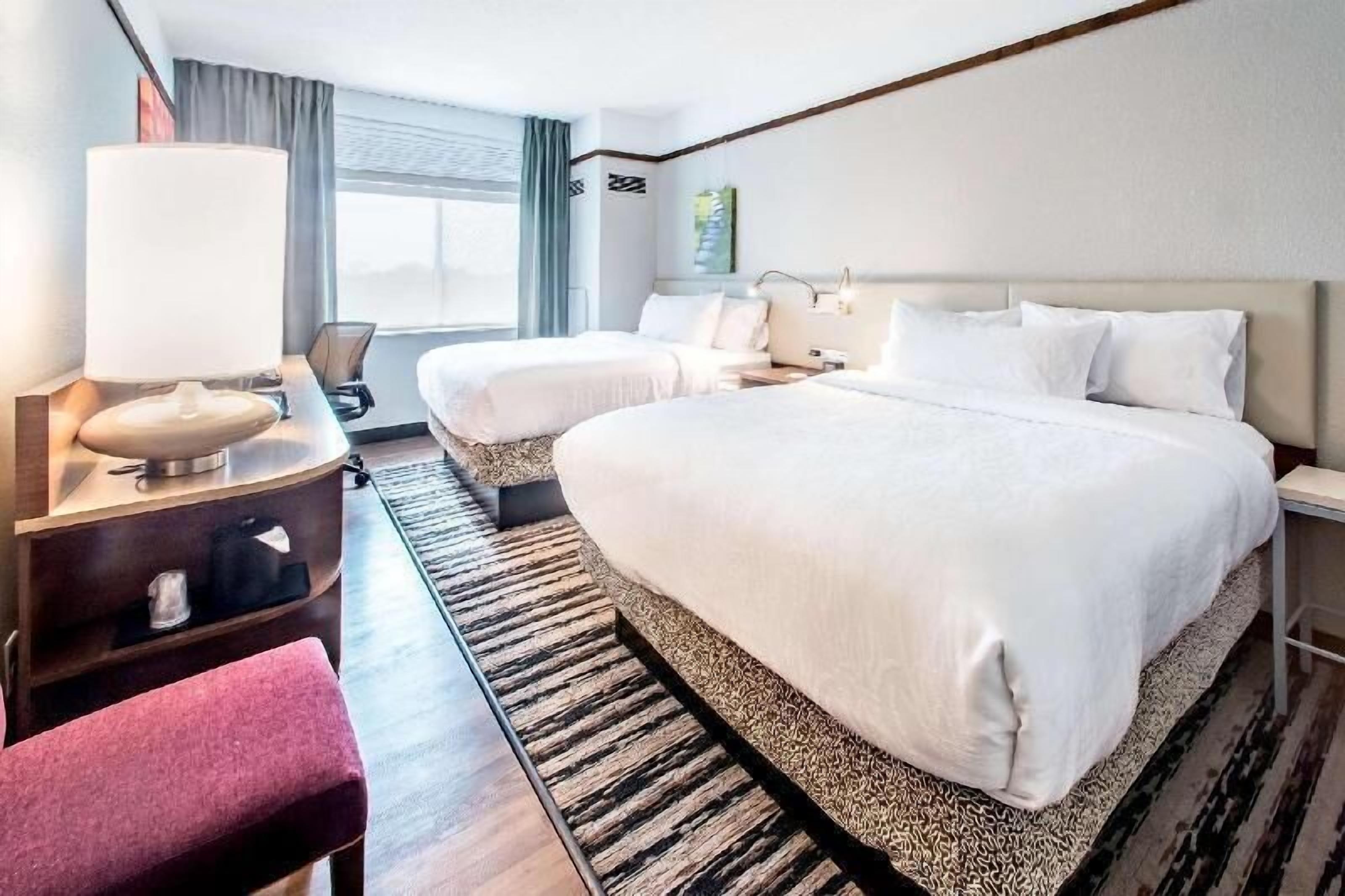 Desk, laptop workspace, blackout drapes, free cribs/infant beds