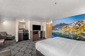 Premium bedding, desk, laptop workspace, blackout drapes