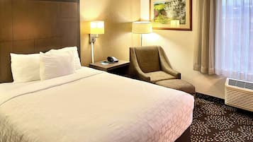 Premium bedding, desk, laptop workspace, blackout drapes