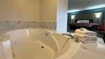 Shower, designer toiletries, hair dryer, towels