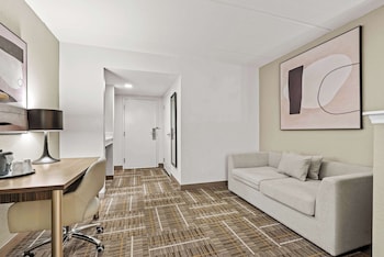 Desk, laptop workspace, blackout drapes, iron/ironing board at Sonesta Essential Orlando