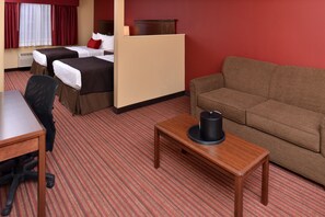 A hotel room with two beds, a sofa, a table, and a chair. - Best Western Woodland Inn (Woodland)