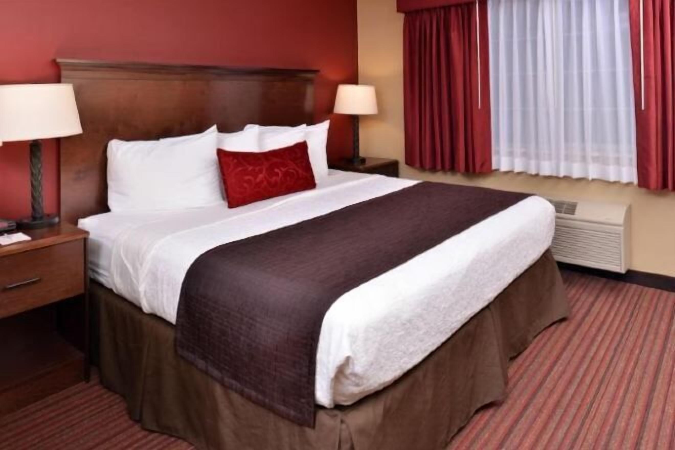 Desk, blackout drapes, iron/ironing board, rollaway beds