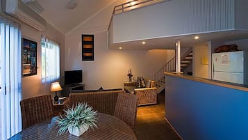 xDeluxe Villa | Living area | Flat-screen TV