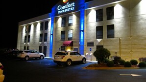A Comfort Inn & Suites hotel with a sign, parking lot, and a building facade. - Comfort Inn & Suites LaGrange East (LaGrange)
