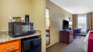 A hotel room with a kitchenette, a TV, a desk, and a bed. - Comfort Inn & Suites LaGrange East (LaGrange)
