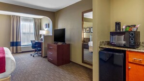 A hotel room with a bed, a desk, a television, a microwave, and a refrigerator. - Comfort Inn & Suites LaGrange East (LaGrange)
