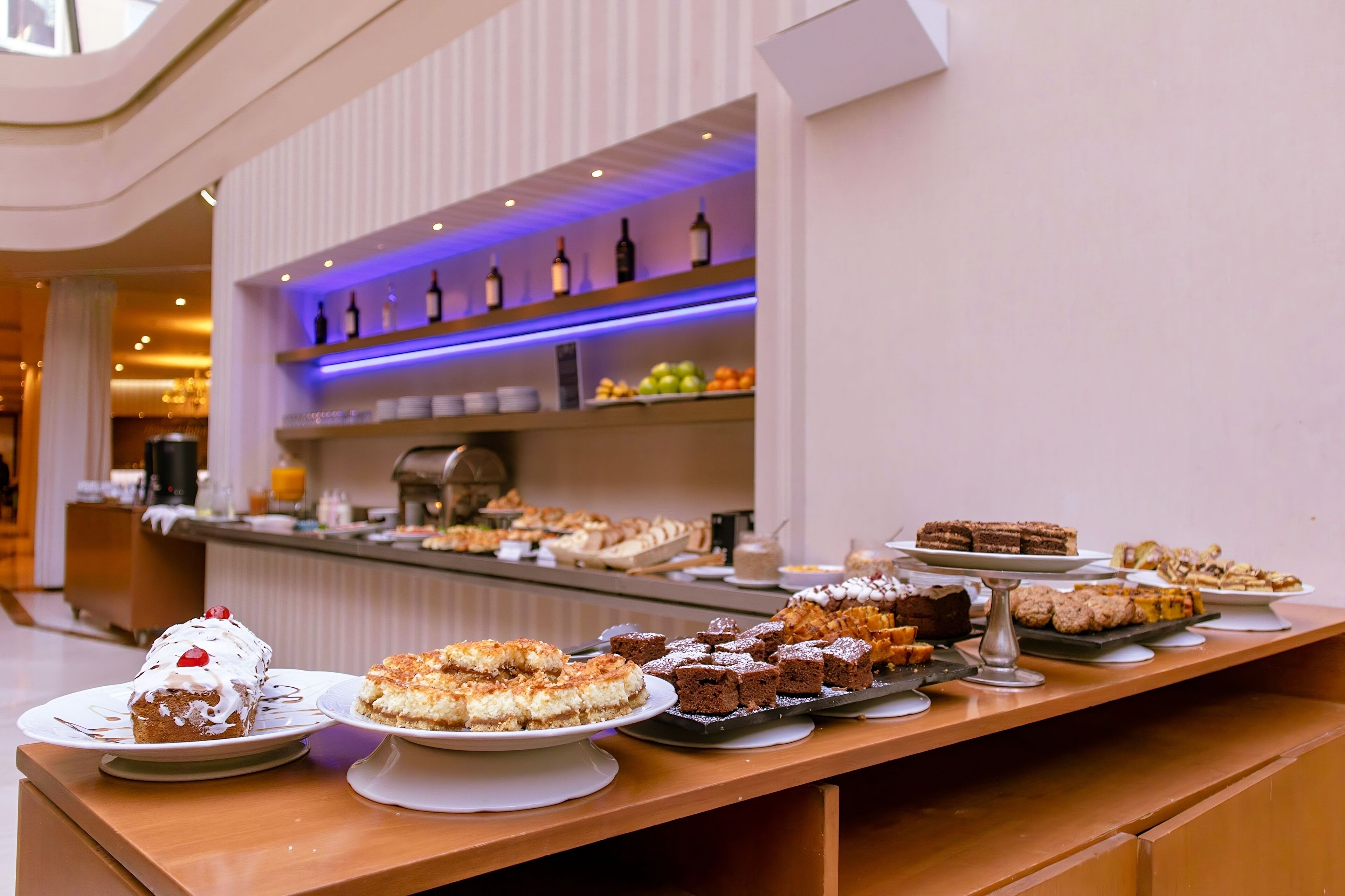 A buffet with various desserts and beverages.