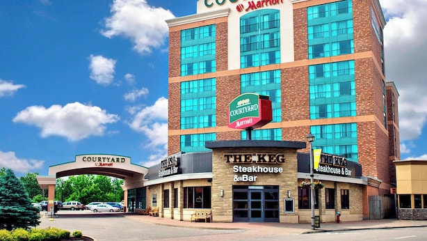 A Courtyard Marriott hotel with a Steakhouse & Bar, The Keg, and a parking area.