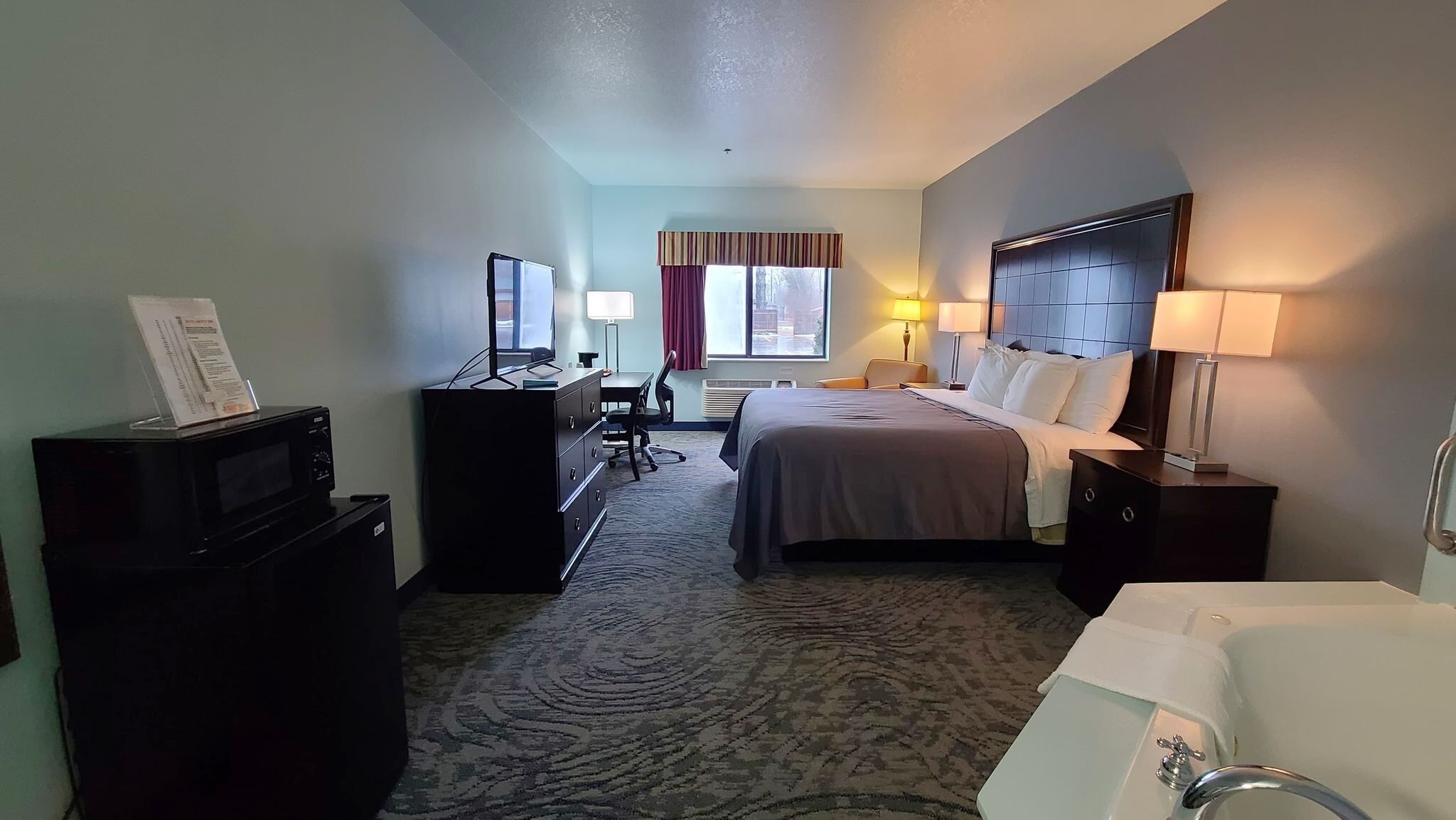 standard suite, 1 king bed (no pets allowed) | 1 bedroom, desk, iron/ironing board, free wifi