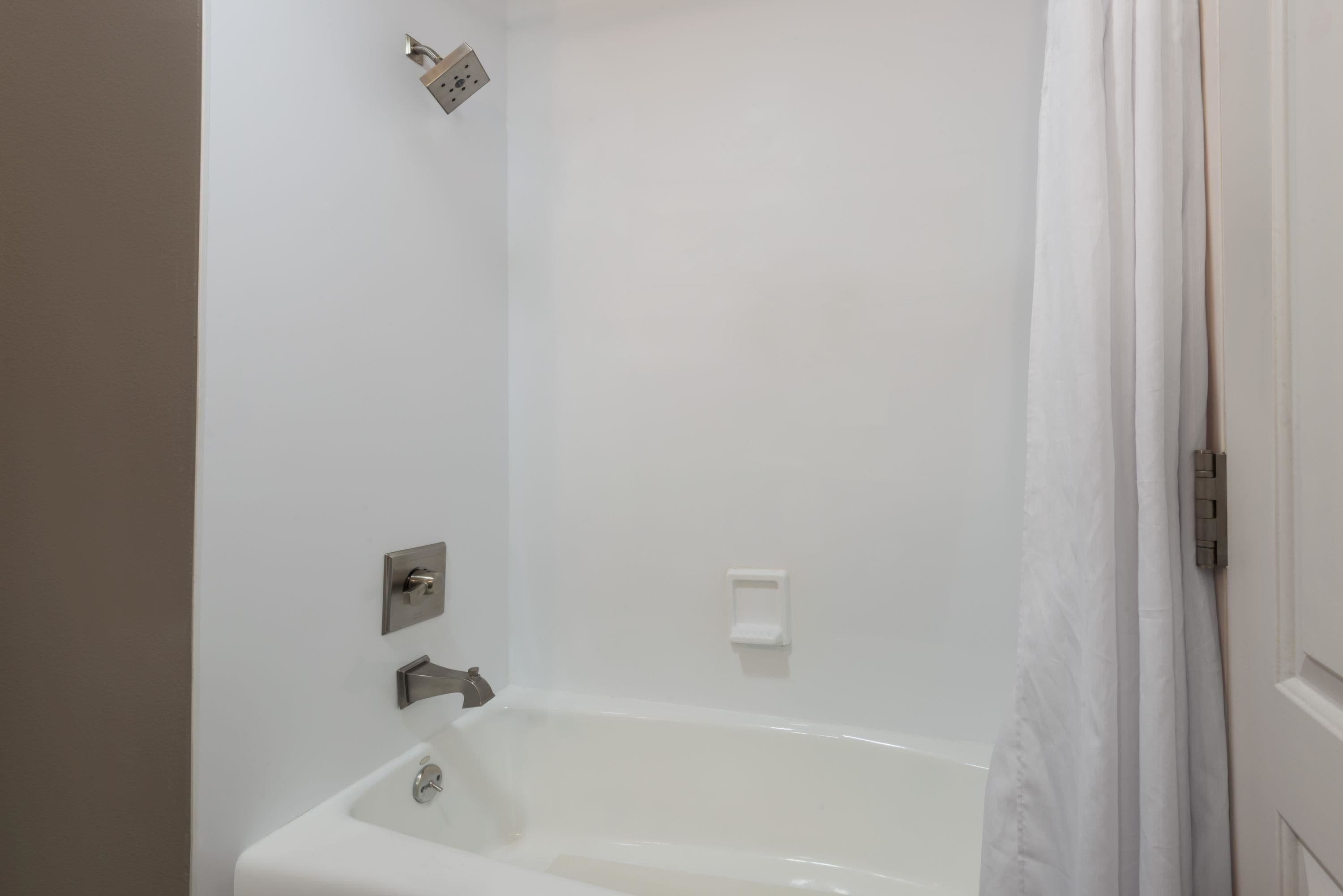 combined shower/bathtub, eco-friendly toiletries, hair dryer, towels
