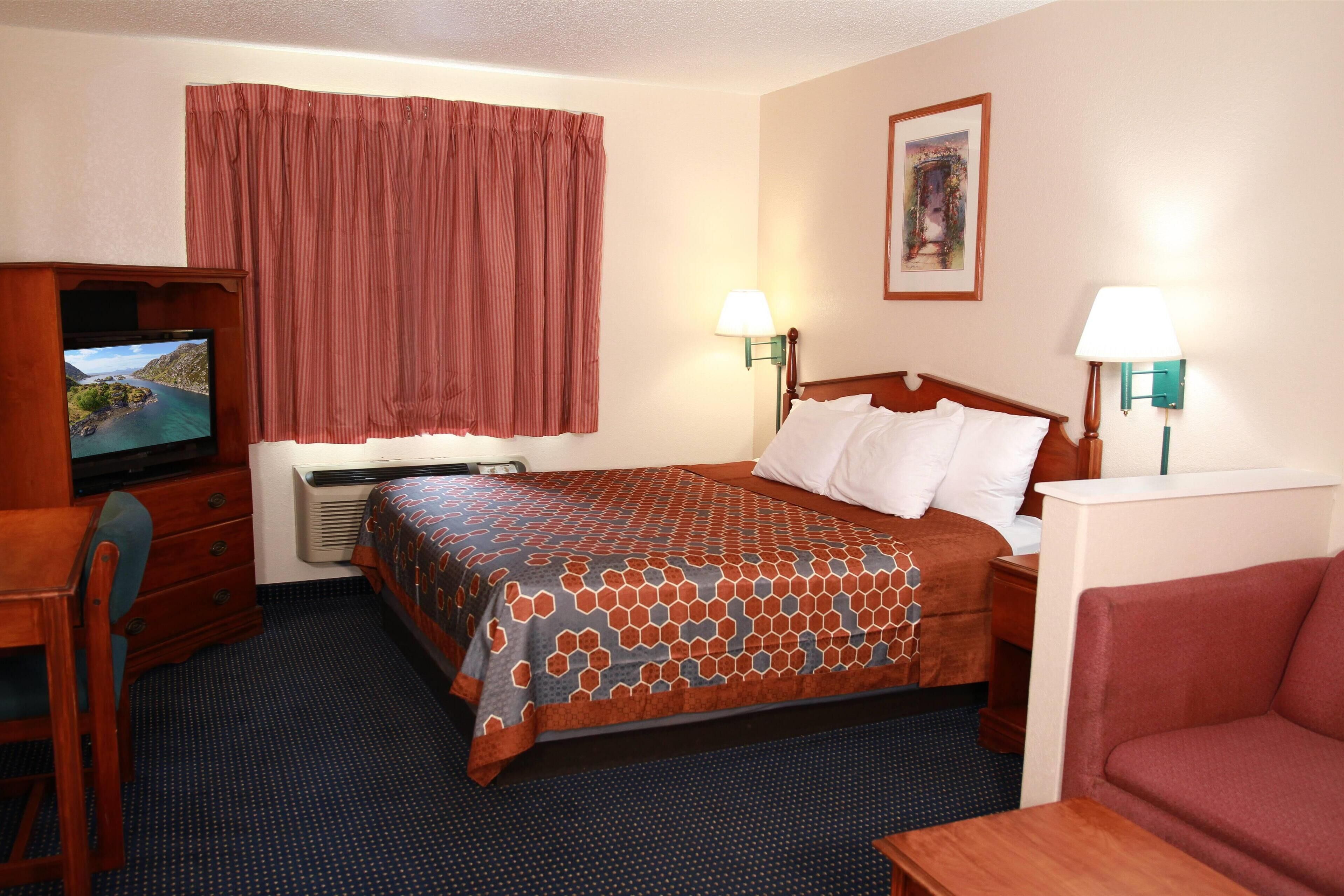 Desk, laptop workspace, blackout curtains, iron/ironing board