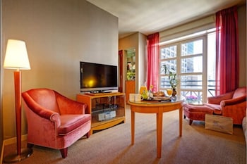 Suite, 1 King Bed with Sofa bed, Balcony | Living area | 42-inch flat-screen TV with cable channels, TV, DVD player at Hotel Giraffe by Library Hotel Collection