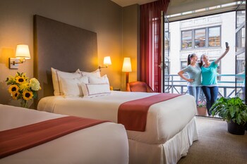 Double Room, 2 Queen Beds, Balcony | Egyptian cotton sheets, premium bedding, down comforters, pillowtop beds at Hotel Giraffe by Library Hotel Collection