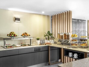 A modern breakfast bar with fruit, pastries, and coffee options. - Mantra on Kent (Sydney)