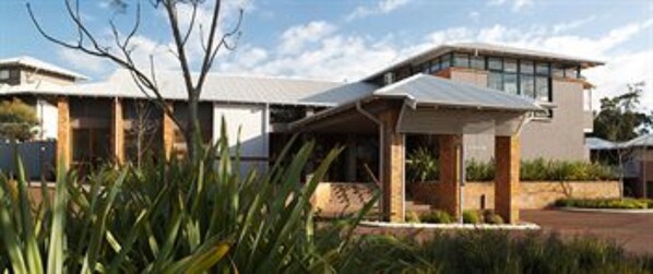 A modern two-story house with a flat roof, large windows, and a covered porch area. - Margarets in Town Apartments (Margaret River)
