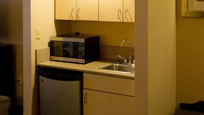 A compact kitchen with a microwave, sink, and dishwasher. - Holiday Inn Express Hotel & Suites Oxford by IHG (Oxford)