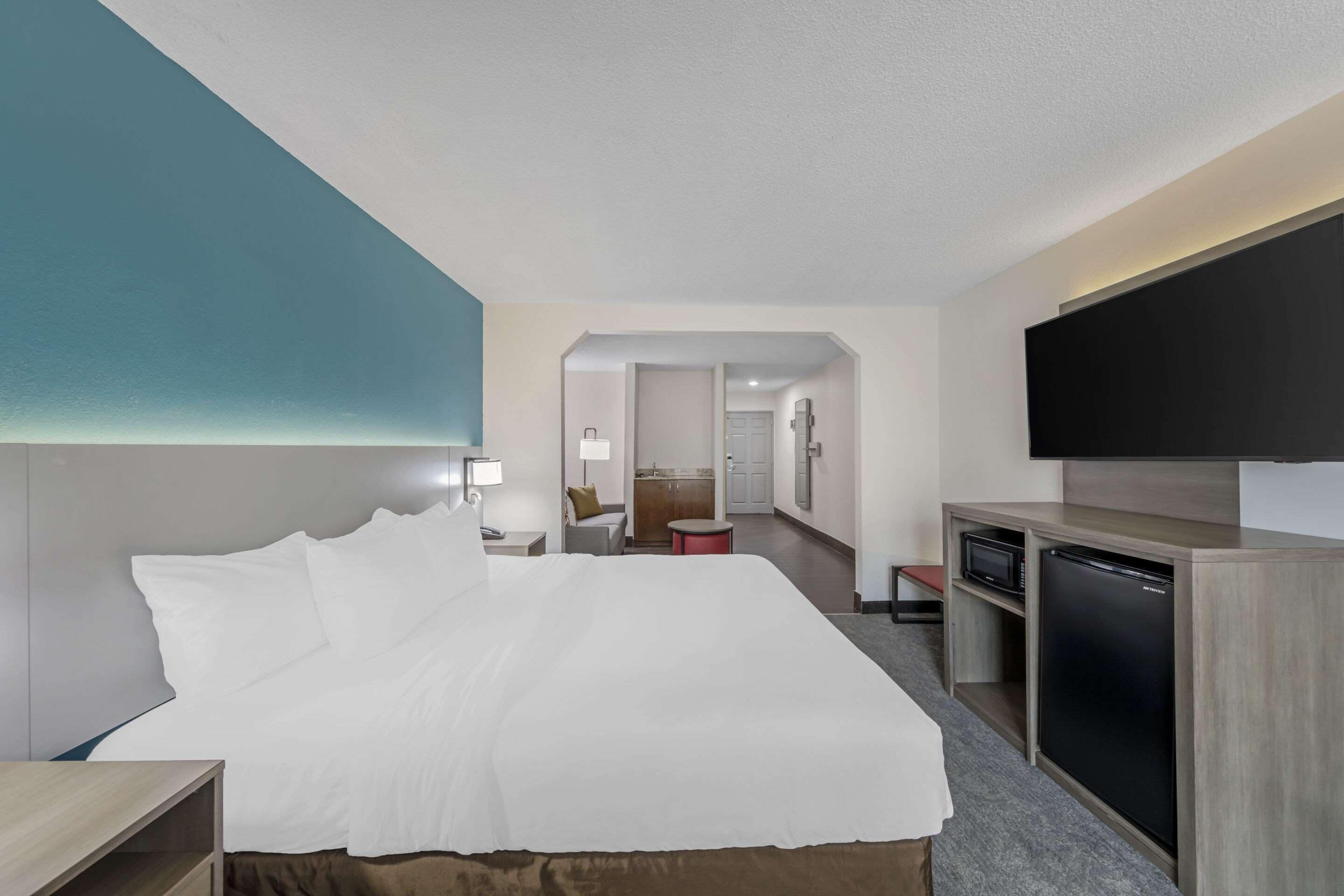 desk, laptop workspace, blackout curtains, iron/ironing board