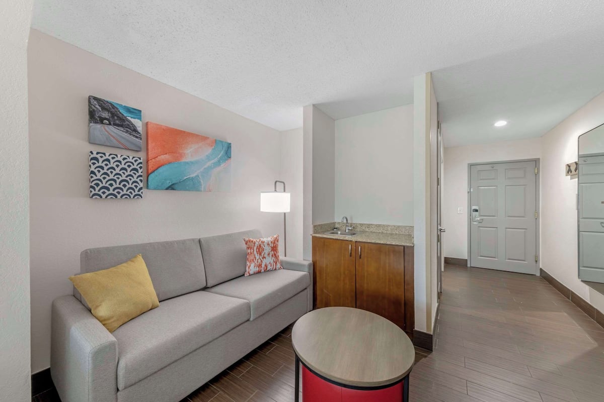 desk, laptop workspace, blackout curtains, iron/ironing board