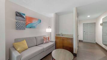 Desk, laptop workspace, blackout drapes, iron/ironing board