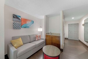 Desk, laptop workspace, blackout drapes, iron/ironing board