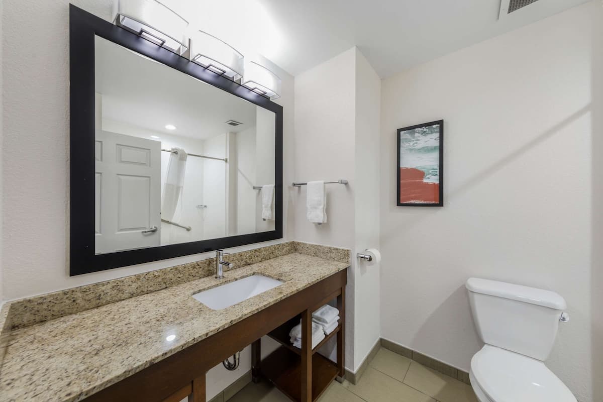 desk, laptop workspace, blackout curtains, iron/ironing board