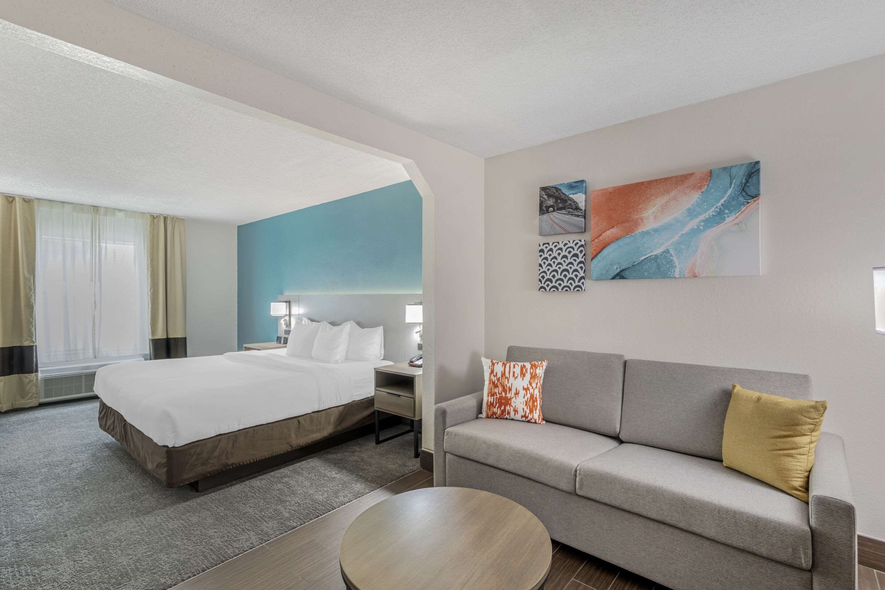 Desk, laptop workspace, blackout drapes, iron/ironing board