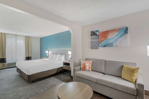 Desk, laptop workspace, blackout drapes, iron/ironing board