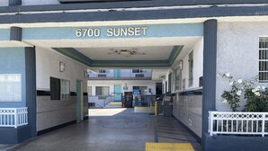 The entrance to a building with a sign reading "6700 Sunset". - Hollywood Guest Inn (Los Angeles)
