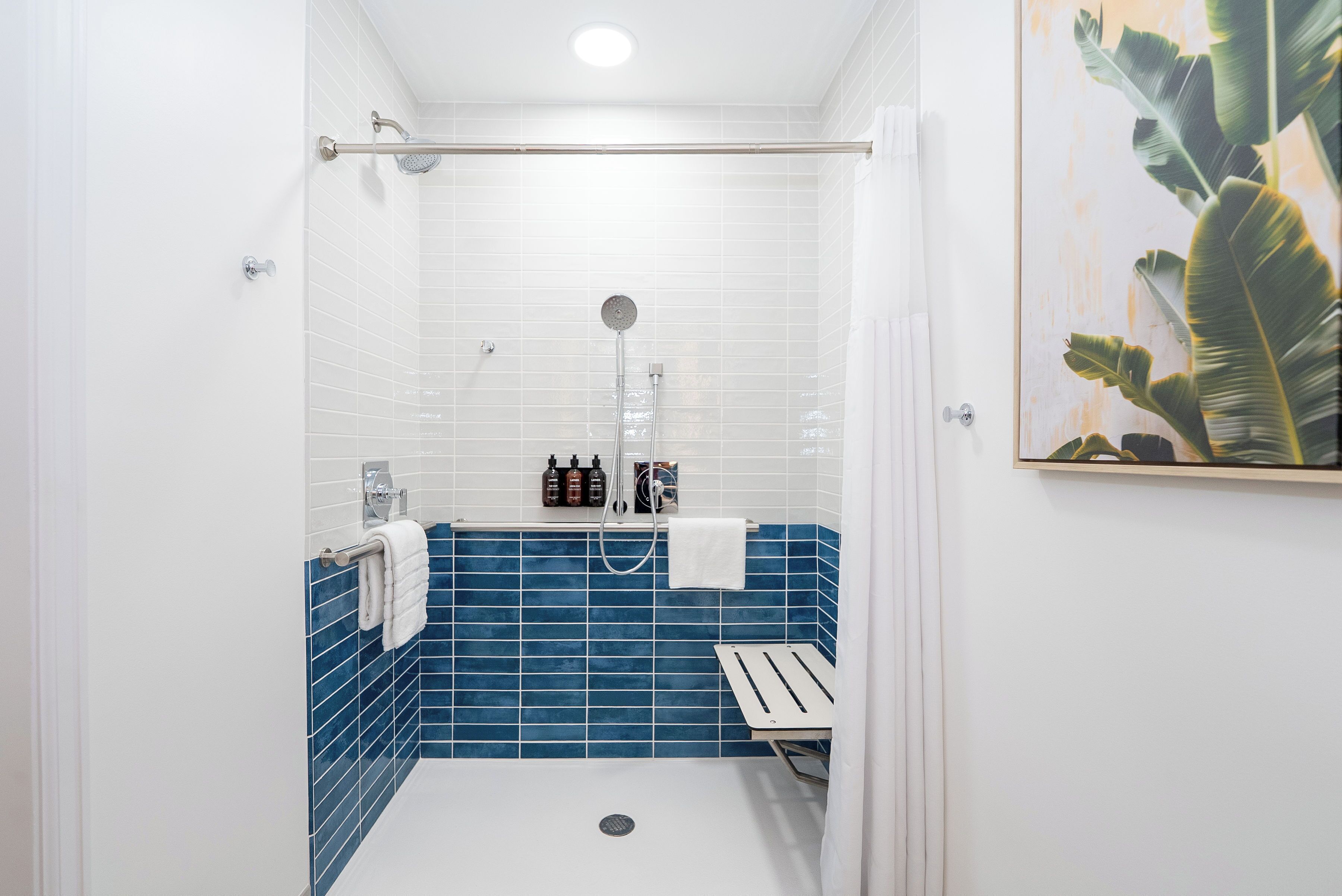 studio suite | bathroom | shower, free toiletries, hair dryer, towels