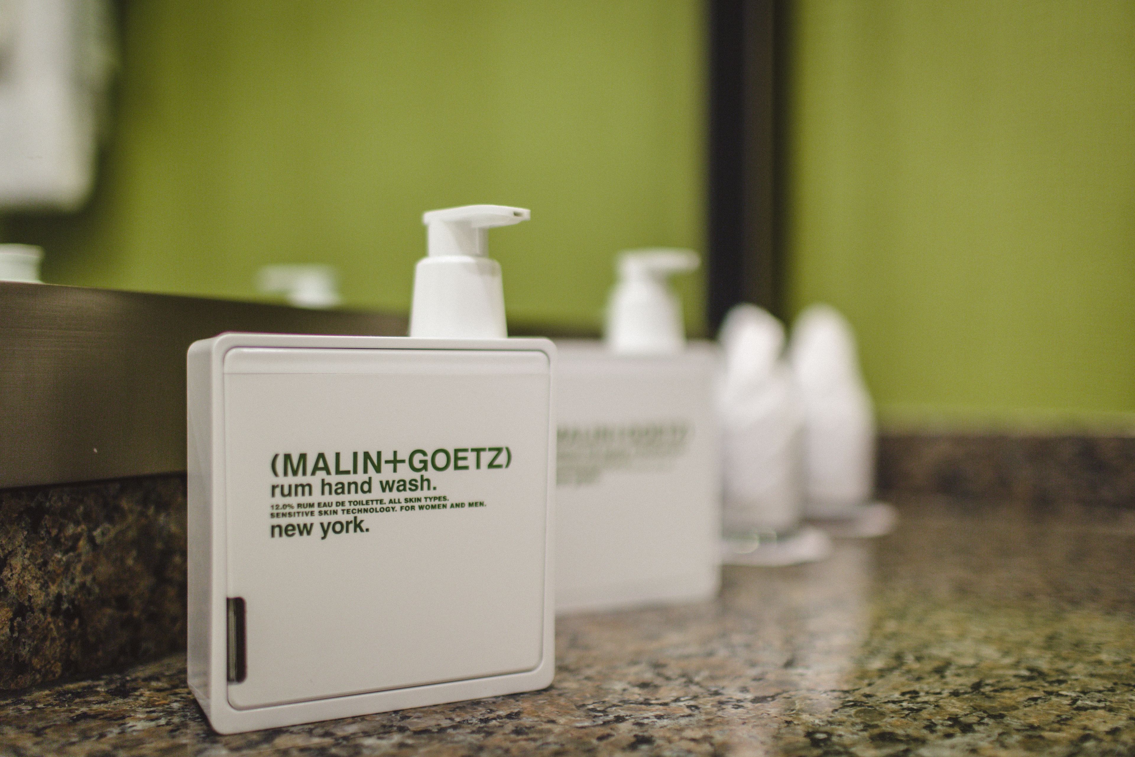 combined shower/bathtub, designer toiletries, hair dryer, bathrobes