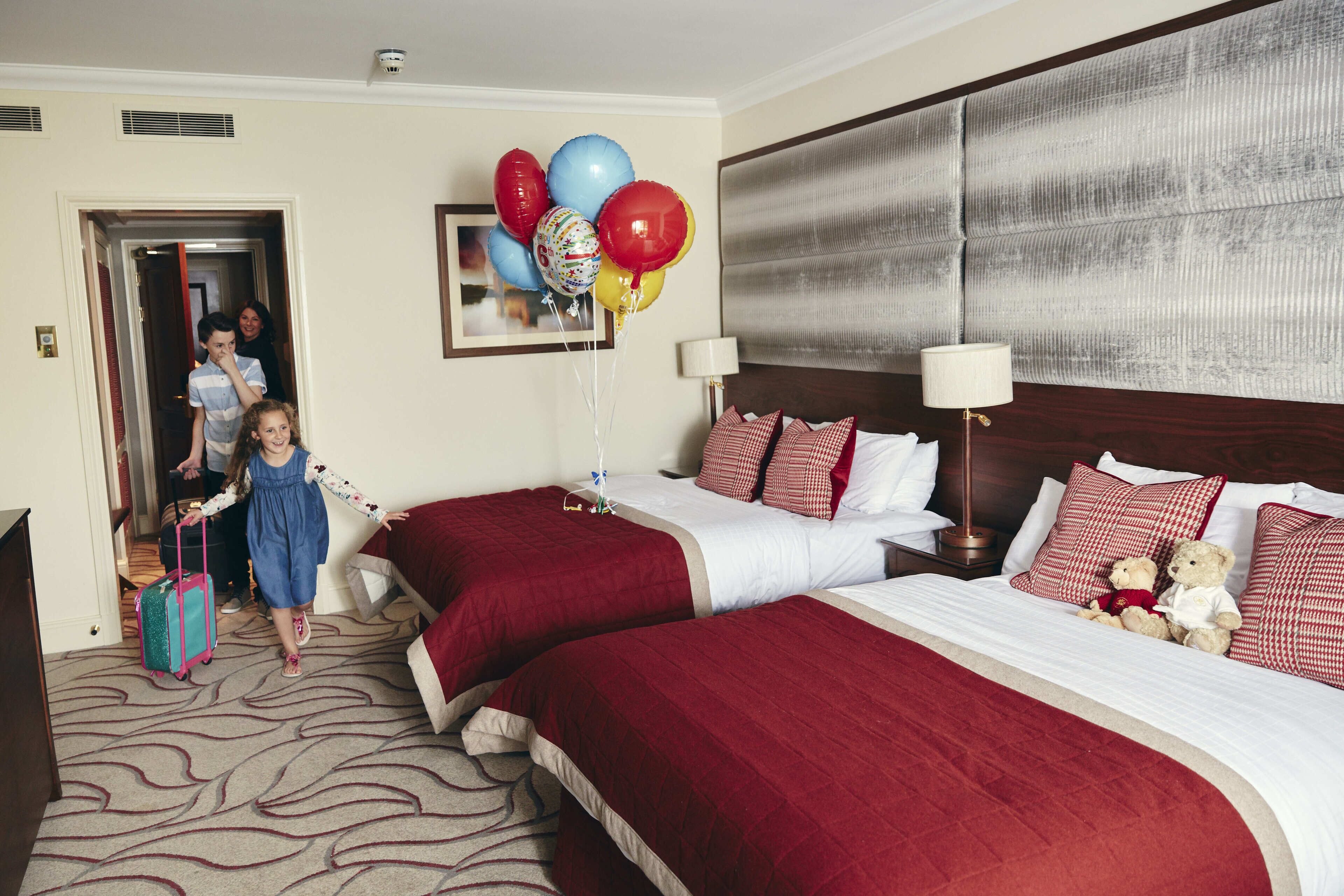 Family Room, 2 Queen Beds | Premium bedding, minibar, in-room safe, desk