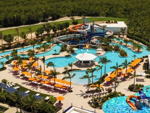 A resort with multiple swimming pools, water slides, and sun loungers. - Aurora Anguilla Resort & Golf Club (Rendezvous Bay)