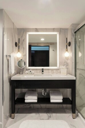 Combined shower/tub, designer toiletries, hair dryer, bathrobes
