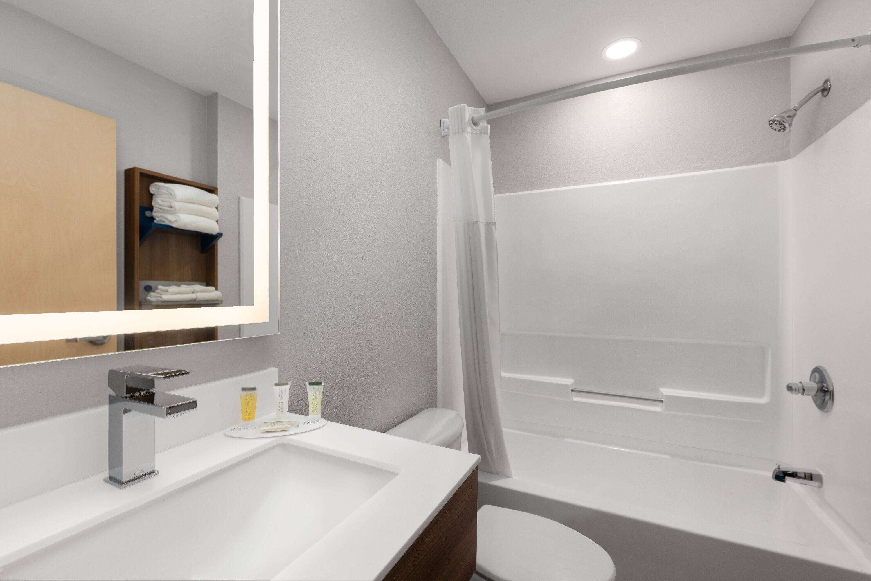 combined shower/bathtub, hair dryer, towels, soap