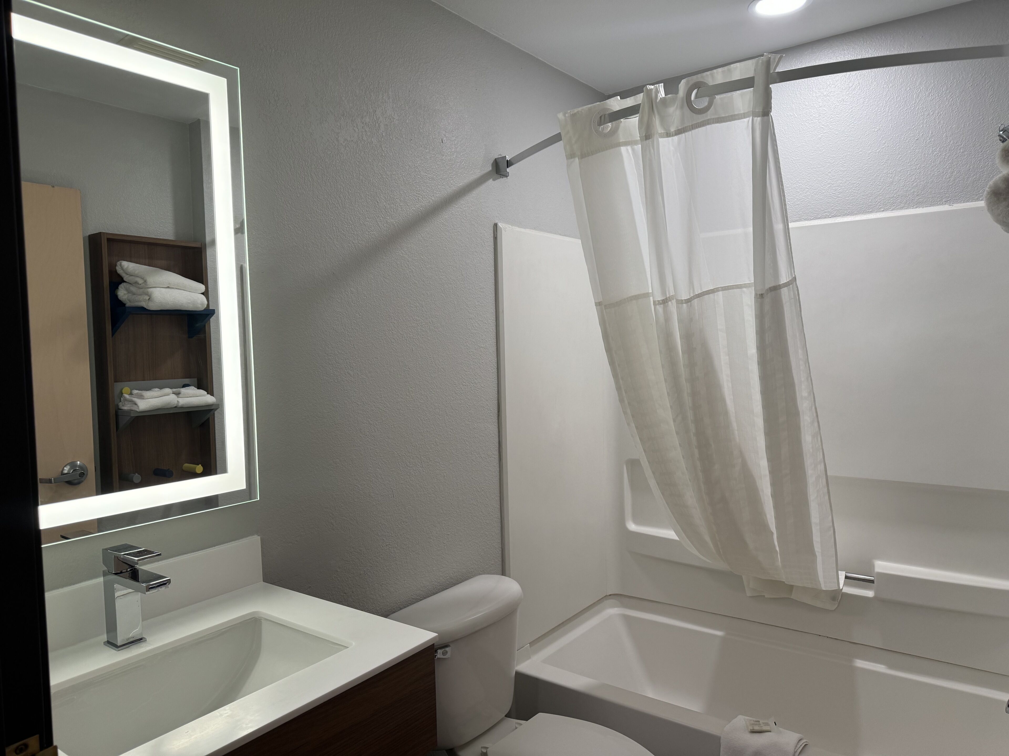 combined shower/bathtub, hair dryer, towels, soap