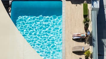 Outdoor pool, pool umbrellas, pool loungers